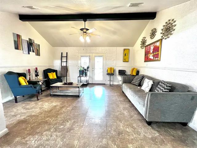 a living room with furniture and couch