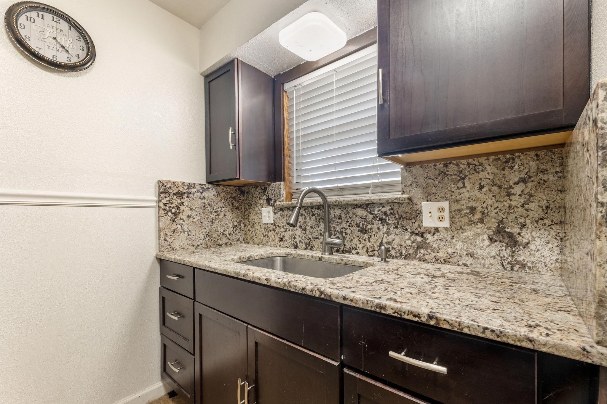 3606 Balmorhea Avenue Houston, TX 77039 - Photo 8 of 21 a bathroom with a granite countertop sink and a mirror
