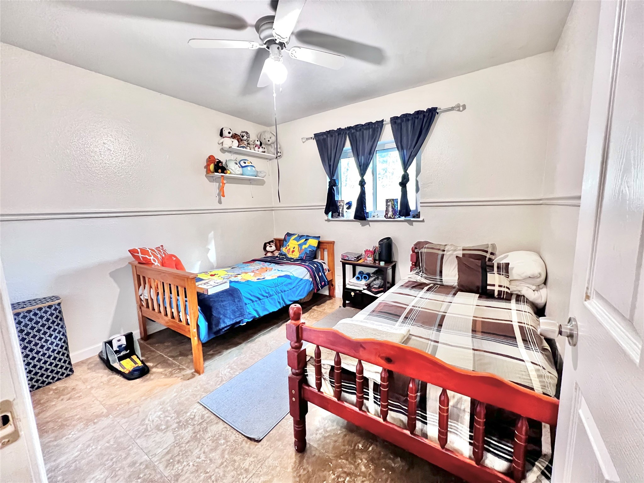 3606 Balmorhea Avenue Houston, TX 77039 - Photo 9 of 21 a bedroom with furniture and a chandelier