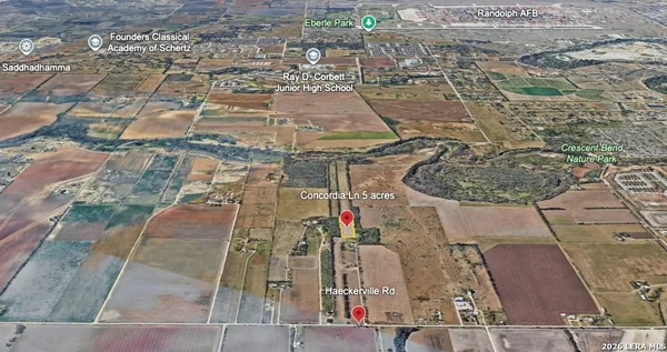 an aerial view of a residential apartment building with an outdoor space