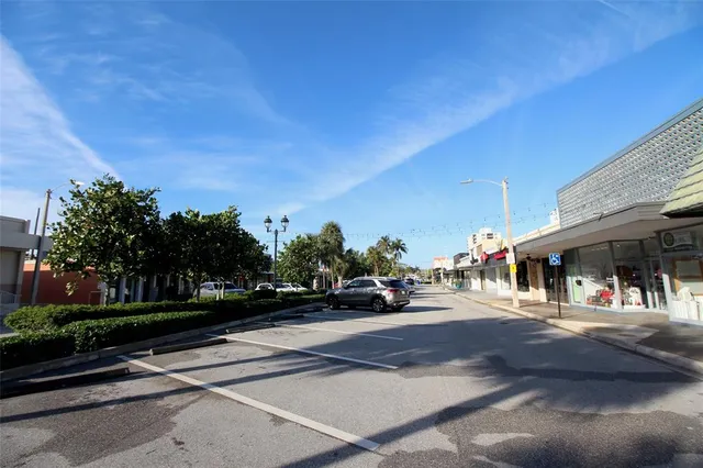 a view of street with parked cars