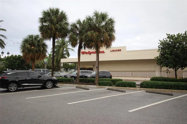 a view of street with parked cars