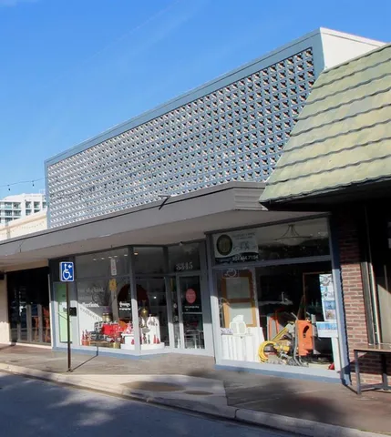 a view of a patio with table and chairs