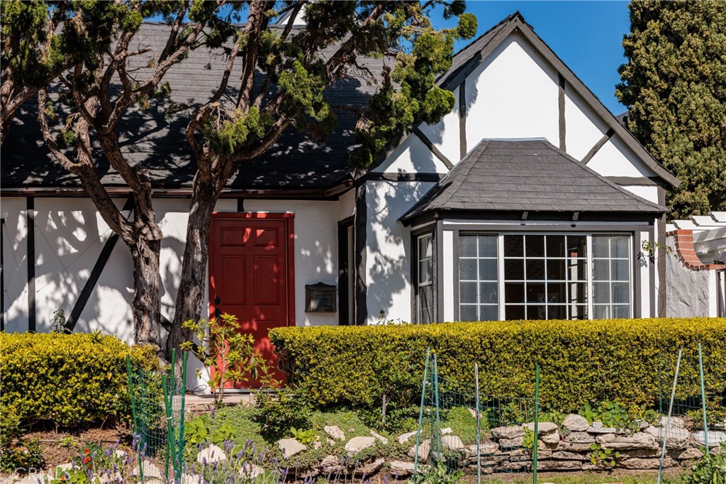 351 Hazel Drive Corona del Mar, CA 92625 - Photo 1 of 58 a view of a house with brick walls and flower plants