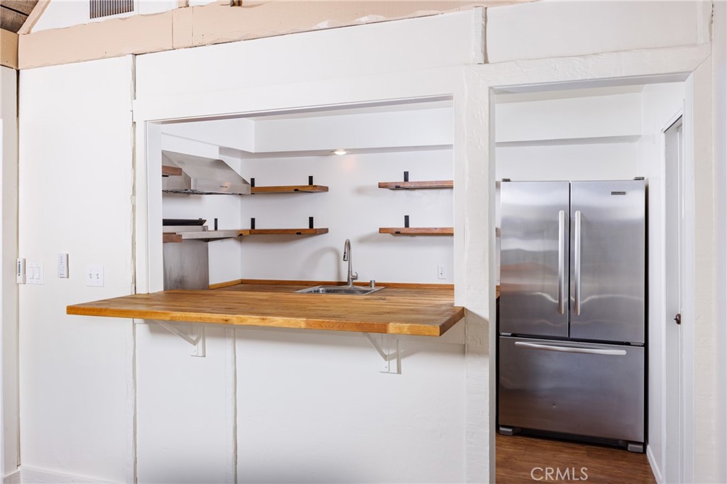 351 Hazel Drive Corona del Mar, CA 92625 - Photo 11 of 58 a kitchen with stainless steel appliances granite countertop a refrigerator and a sink