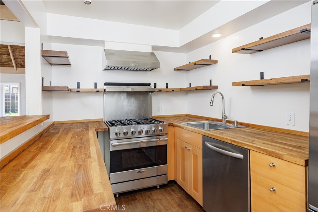 351 Hazel Drive Corona del Mar, CA 92625 - Photo 13 of 58 a kitchen with a stove and a sink