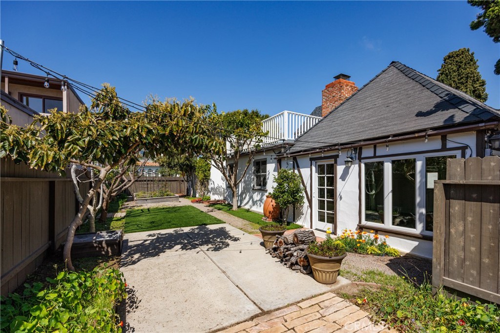 351 Hazel Drive Corona del Mar, CA 92625 - Photo 28 of 58 a view of a house with backyard and garden