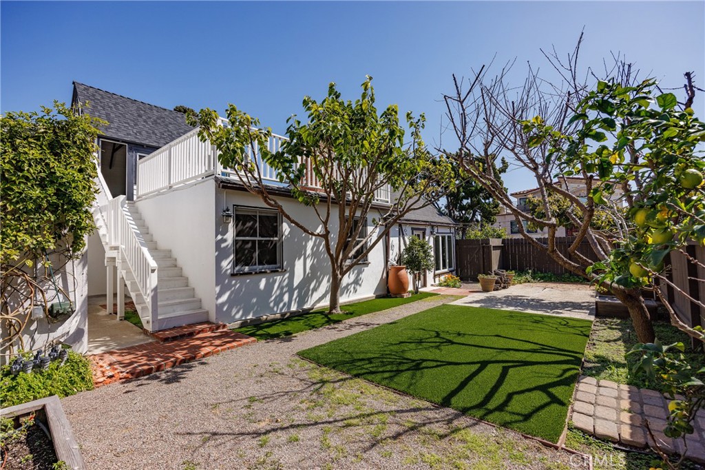 351 Hazel Drive Corona del Mar, CA 92625 - Photo 33 of 58 a front view of a house with garden
