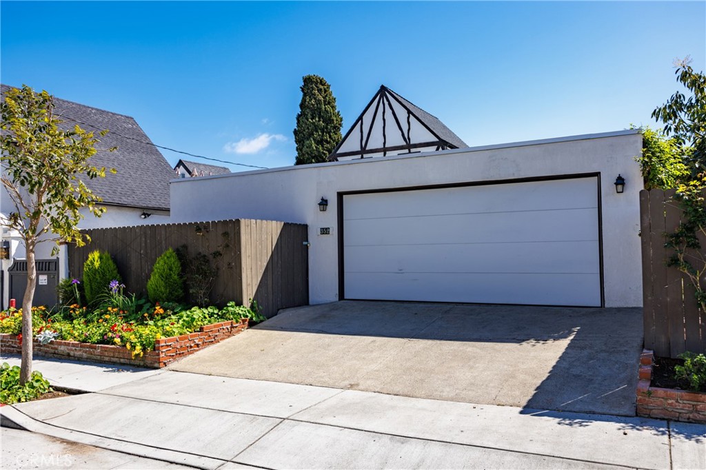 351 Hazel Drive Corona del Mar, CA 92625 - Photo 55 of 58 a front view of a house with garden