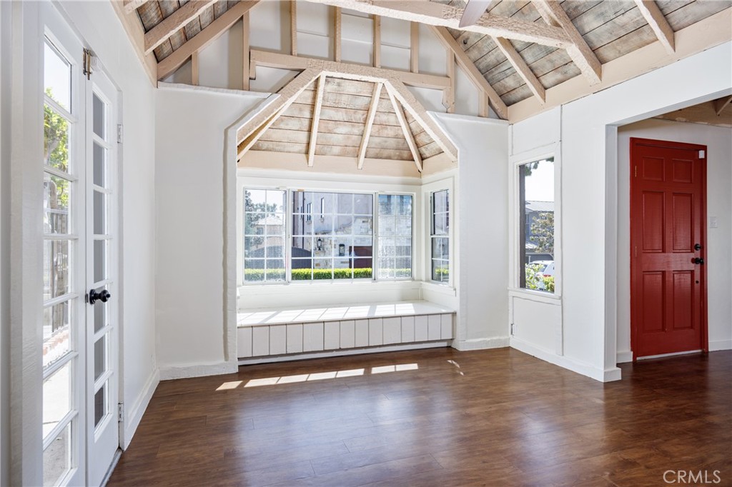 351 Hazel Drive Corona del Mar, CA 92625 - Photo 7 of 58 an empty room with wooden floor and windows
