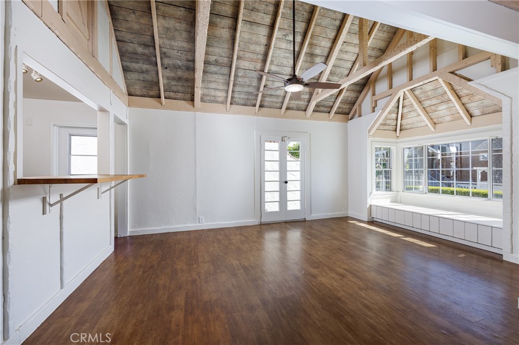 351 Hazel Drive Corona del Mar, CA 92625 - Photo 9 of 58 a view of an empty room with wooden floor and a window