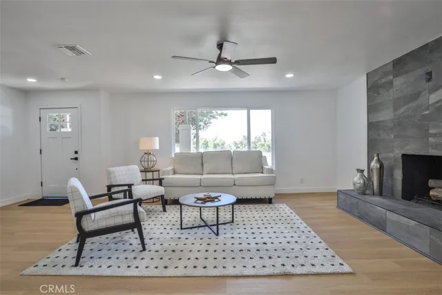 a living room with furniture and a rug