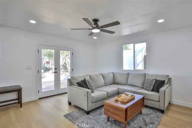 a living room with furniture and a window