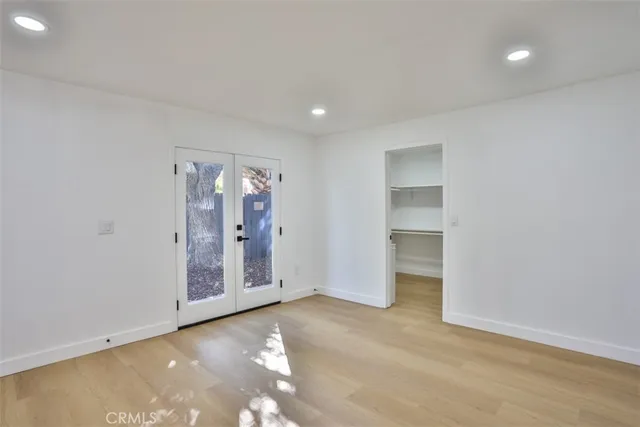 a bathroom with double vanity sink and a mirror