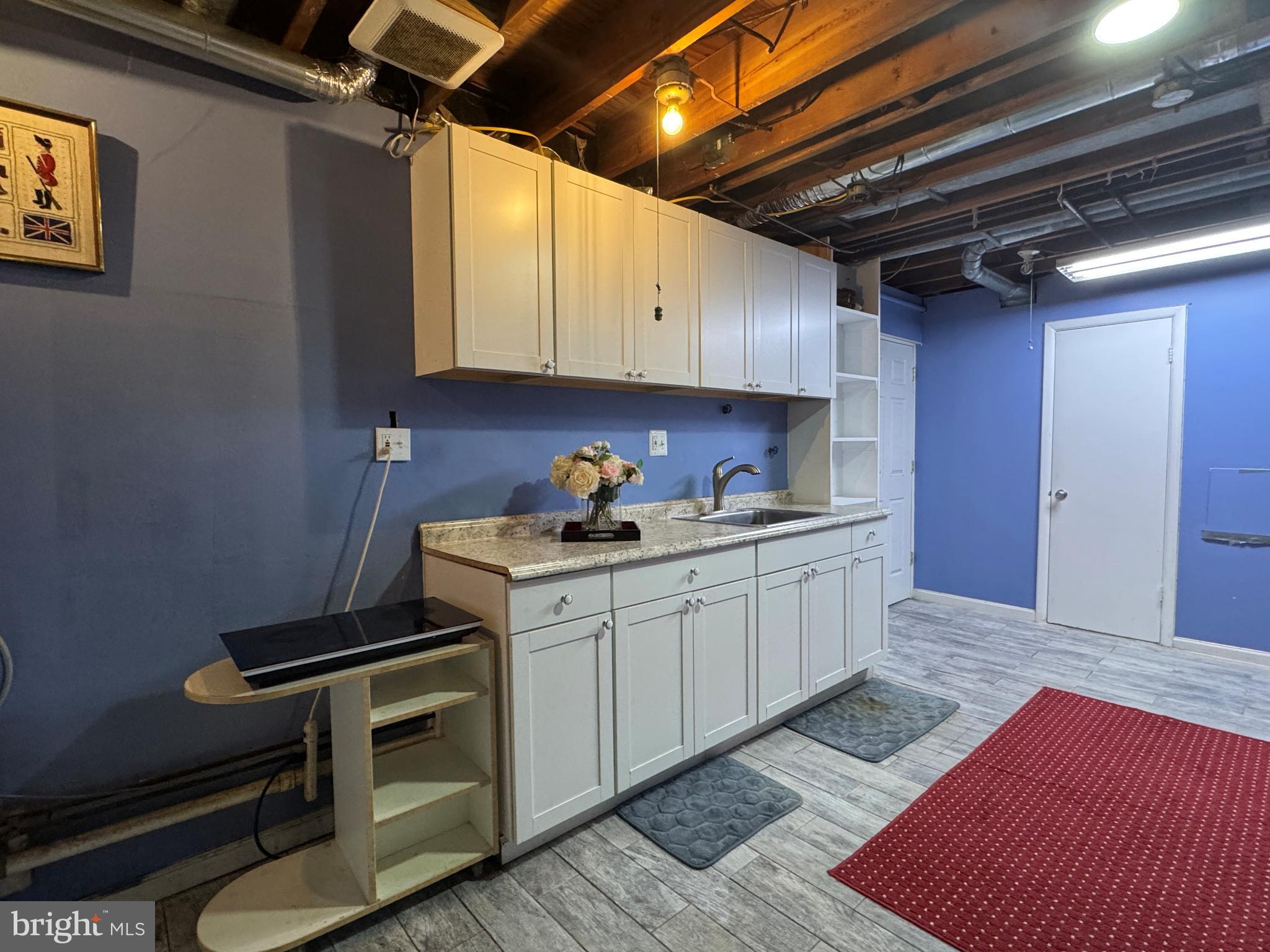 5632 Inverchapel Road Springfield, VA 22151 - Photo 10 of 16 a kitchen with sink and cabinets