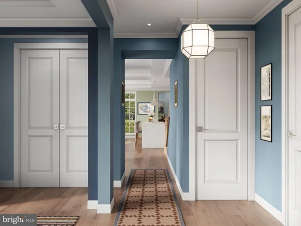 a view of hallway with a livingroom and chandelier