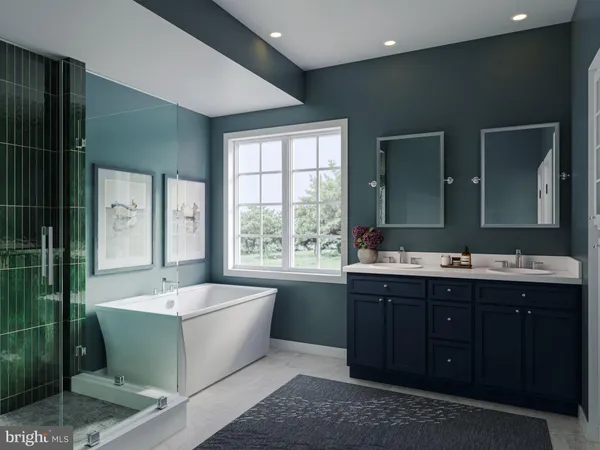 a bathroom with a large tub sink and mirror