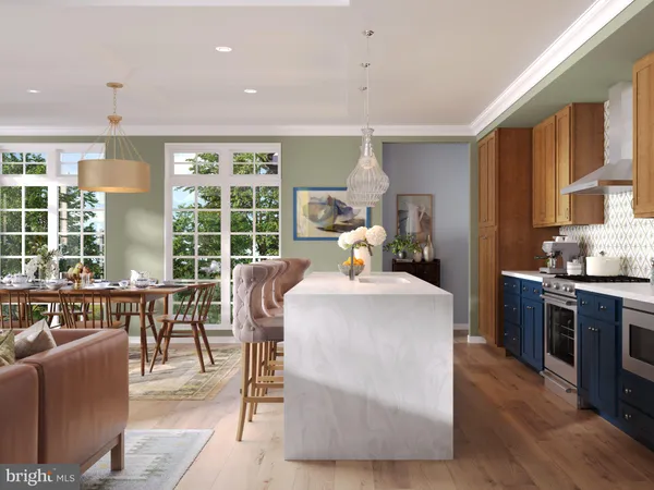 a living room with furniture a large window and wooden floors