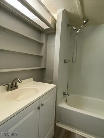 a bathroom with a sink and a bathtub