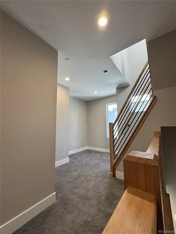 an entryway in a hall with a window