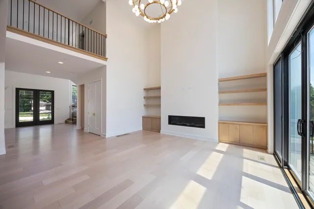 a view of a livingroom with furniture and a kitchen