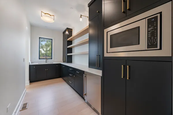 a kitchen with a sink and cabinets