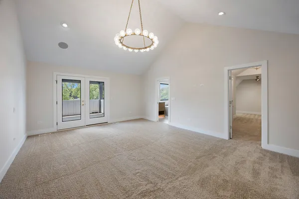 a spacious bathroom with a double vanity sink a large mirror and a shower