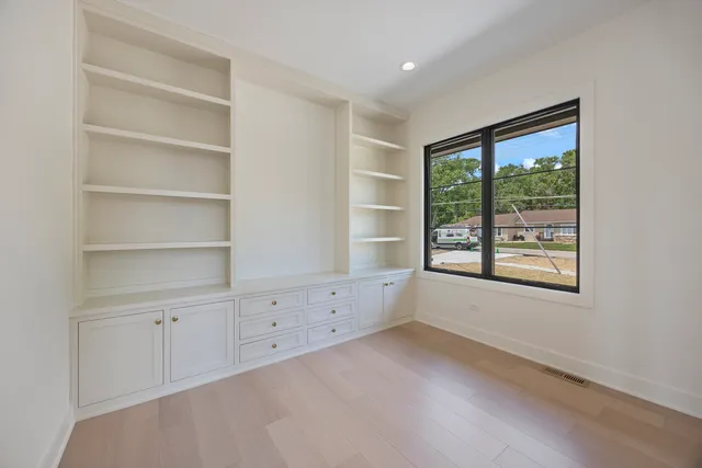 a bathroom with a double vanity sink mirror and bathtub