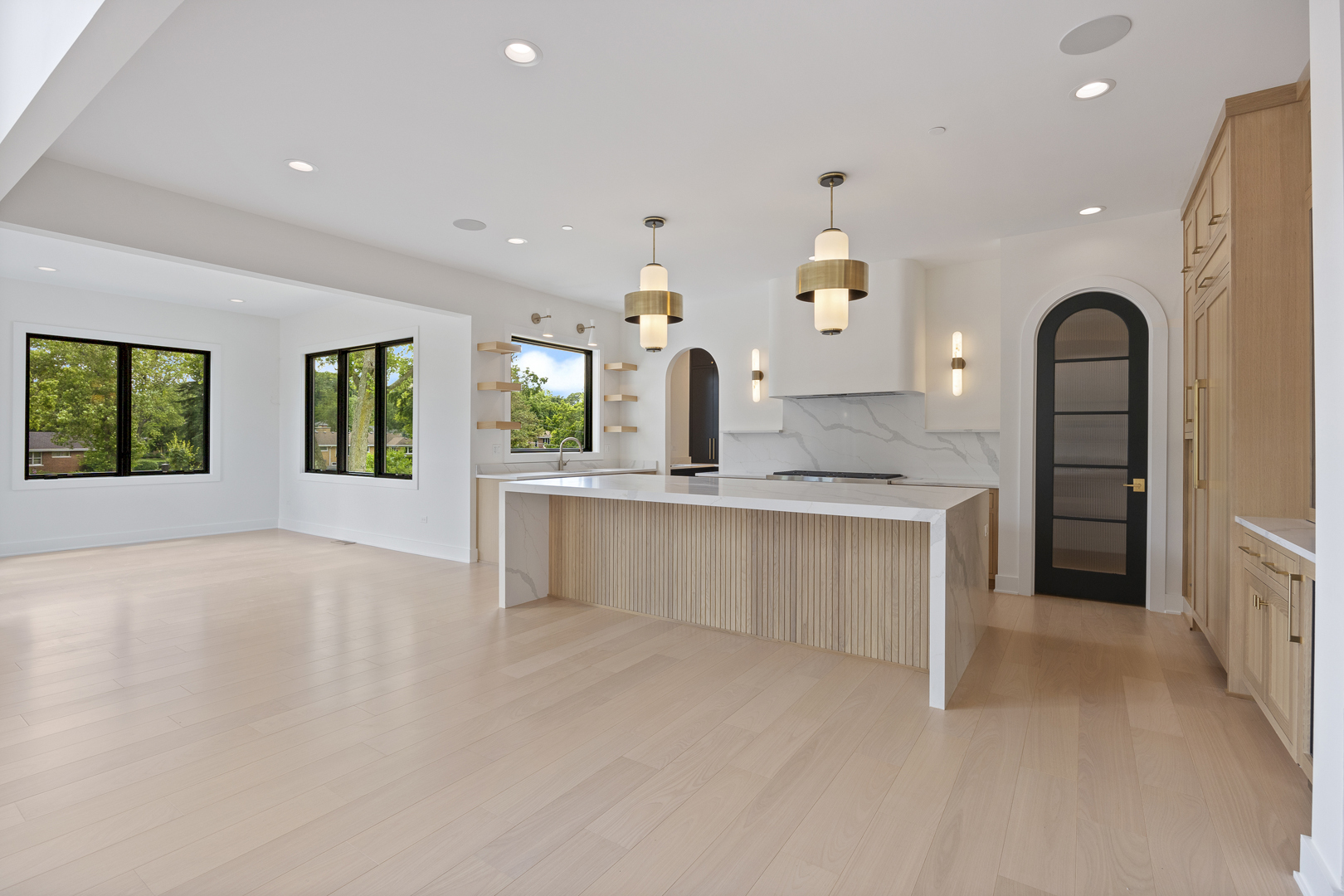11901 Heritage Drive Burr Ridge, IL 60527 - Photo 6 of 47 an entryway with chandelier and a kitchen
