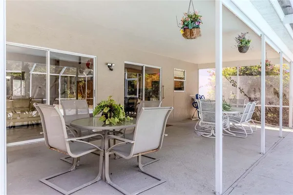 a dining room with furniture and window