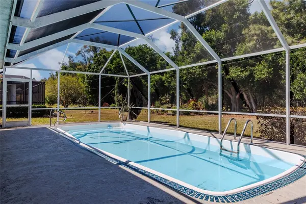 a view of a swimming pool with a patio