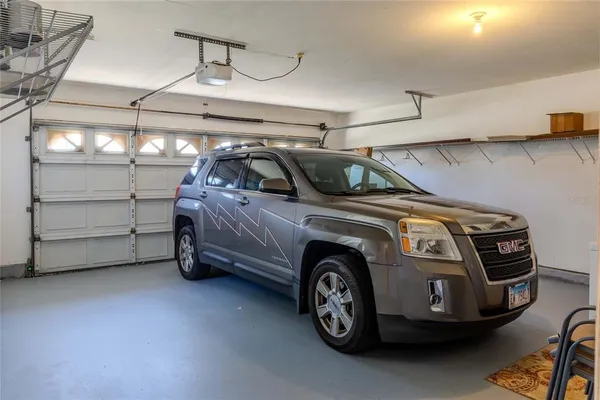 a view of a garage and car parked