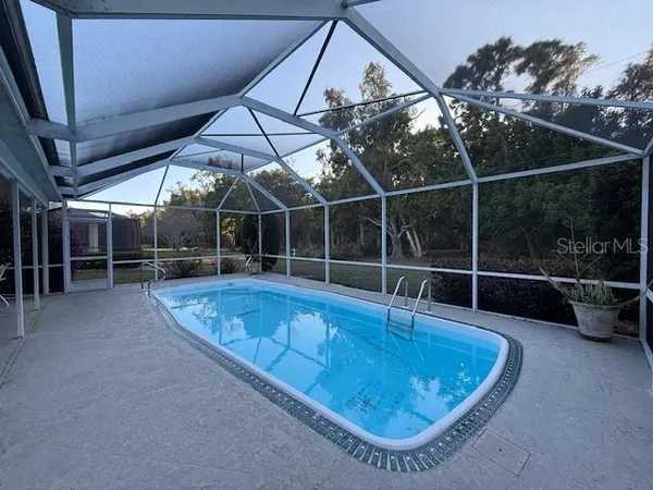 a view of a swimming pool with a patio