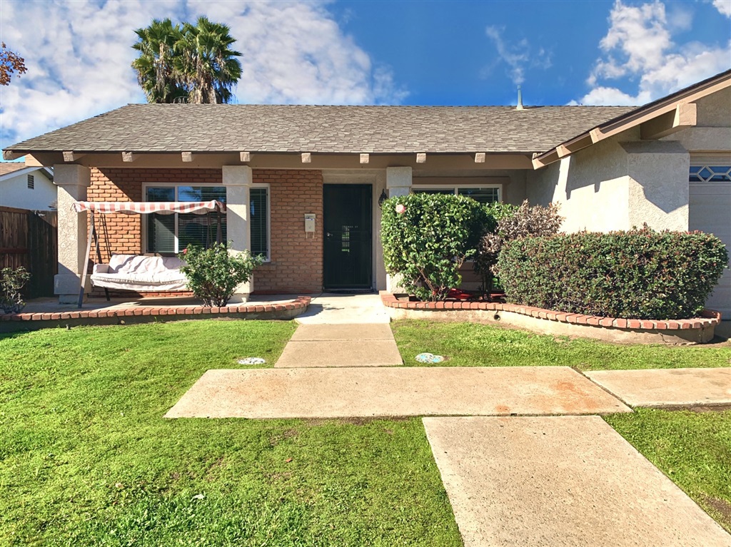 10354 Molino Road Santee, CA 92071 - Photo 1 of 1 a front view of a house with garden