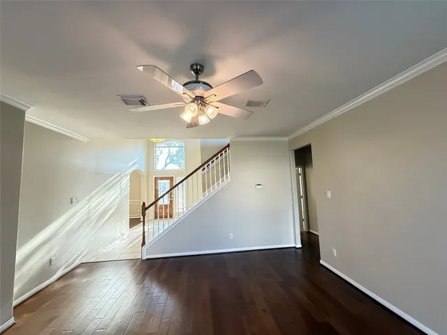 a view of an entryway with wooden floor