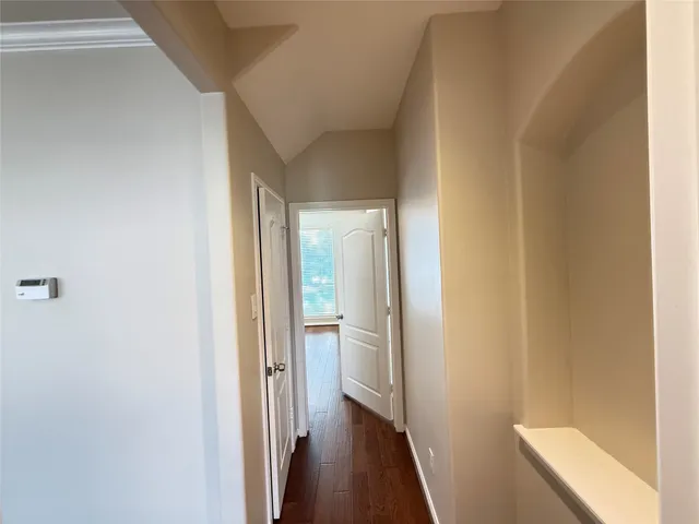 a view of a bathroom from a hallway