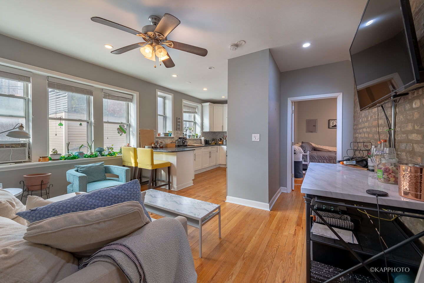 1323 West Addison Street, Unit 1B Chicago, IL 60613 - Photo 17 of 25 a living room with furniture and a large window