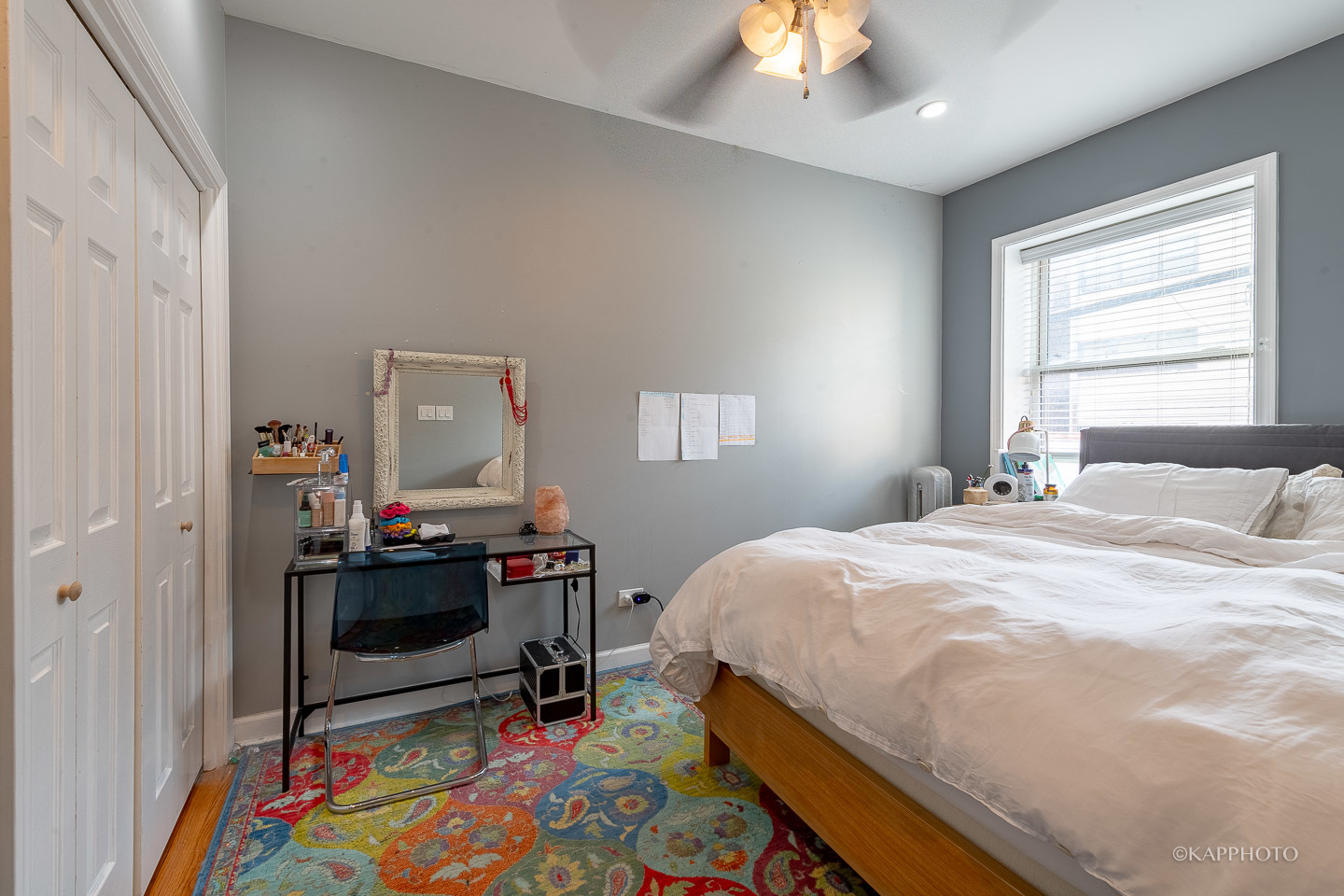 1323 West Addison Street, Unit 1B Chicago, IL 60613 - Photo 19 of 25 a bedroom with a bed and a wooden floor