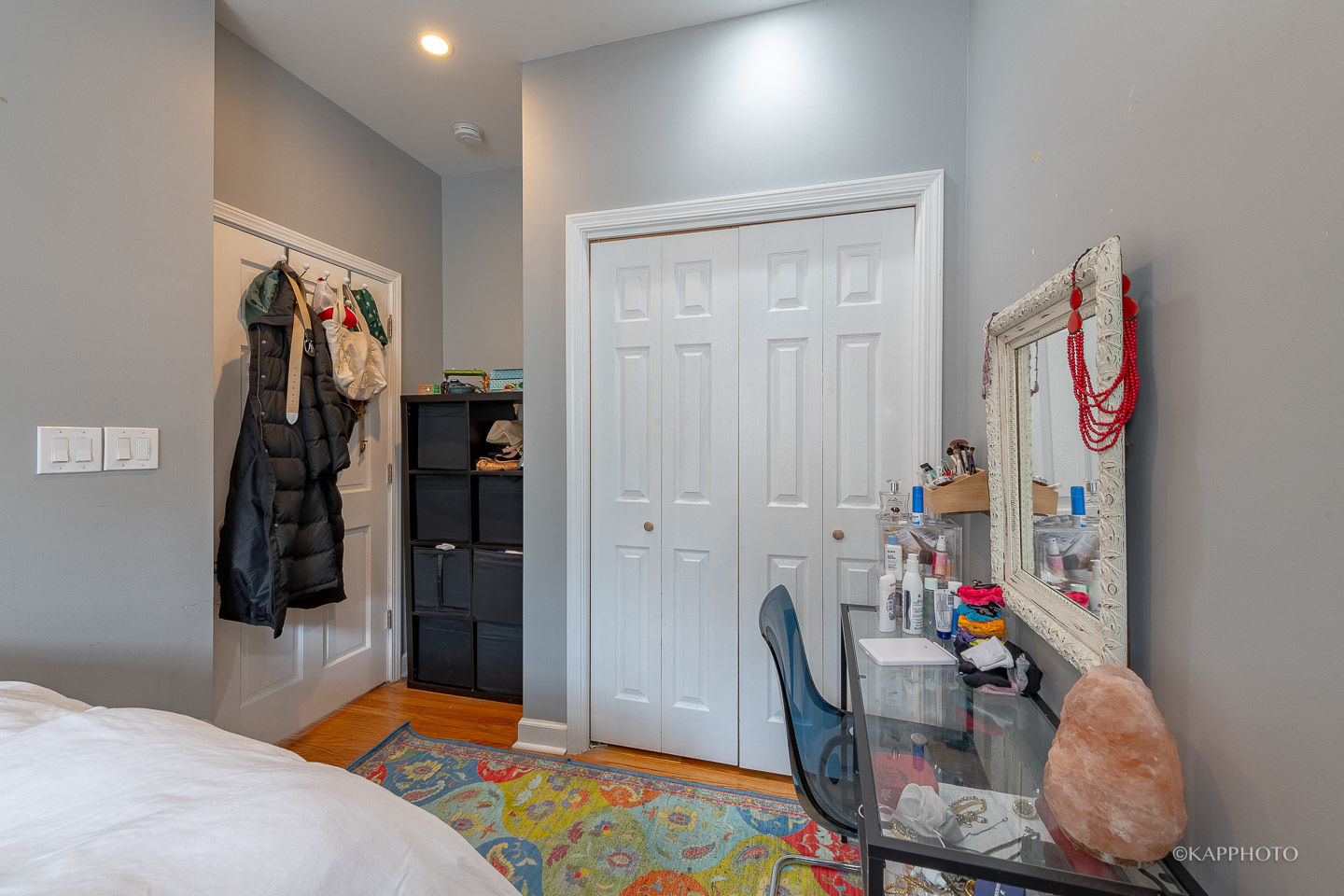 1323 West Addison Street, Unit 1B Chicago, IL 60613 - Photo 20 of 25 a bedroom with a bed and wooden floor
