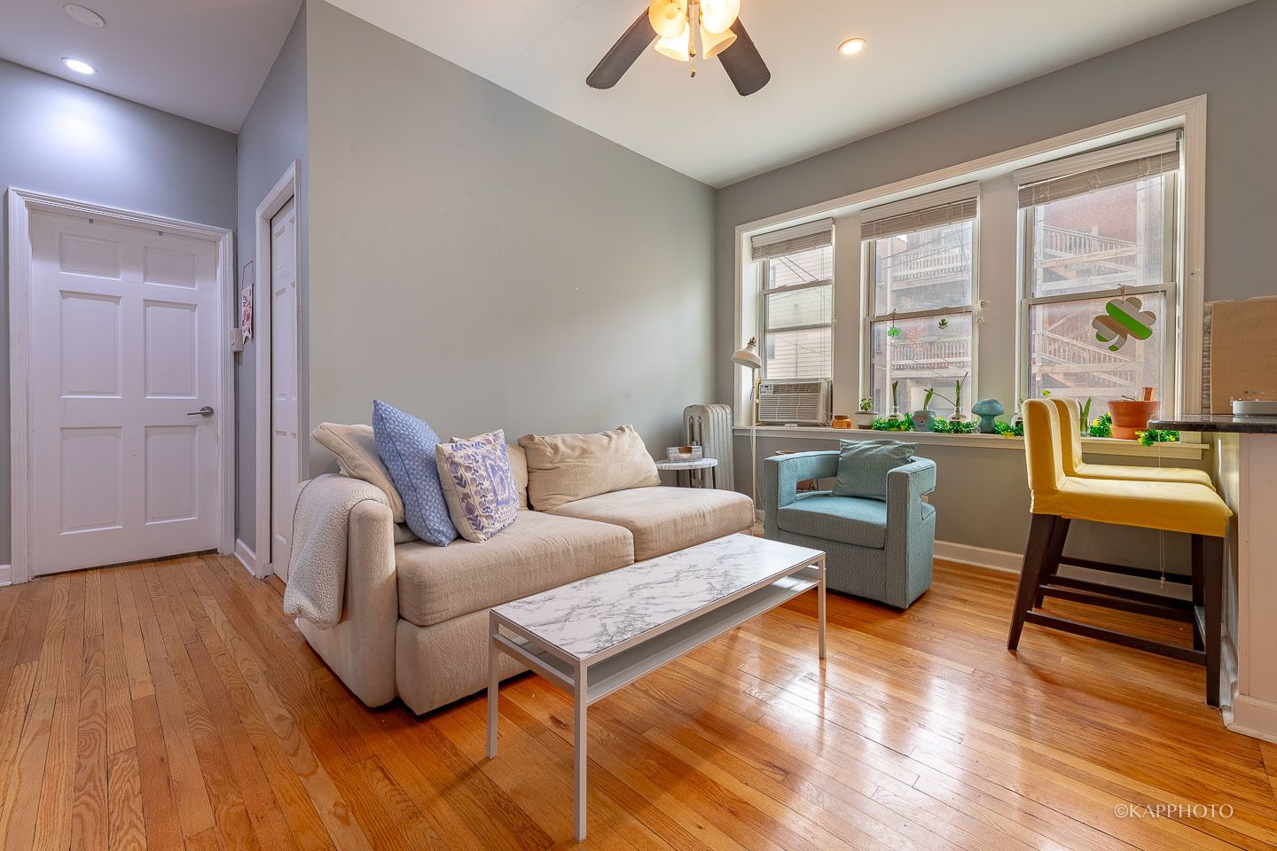 1323 West Addison Street, Unit 1B Chicago, IL 60613 - Photo 8 of 25 a living room with furniture and a large window