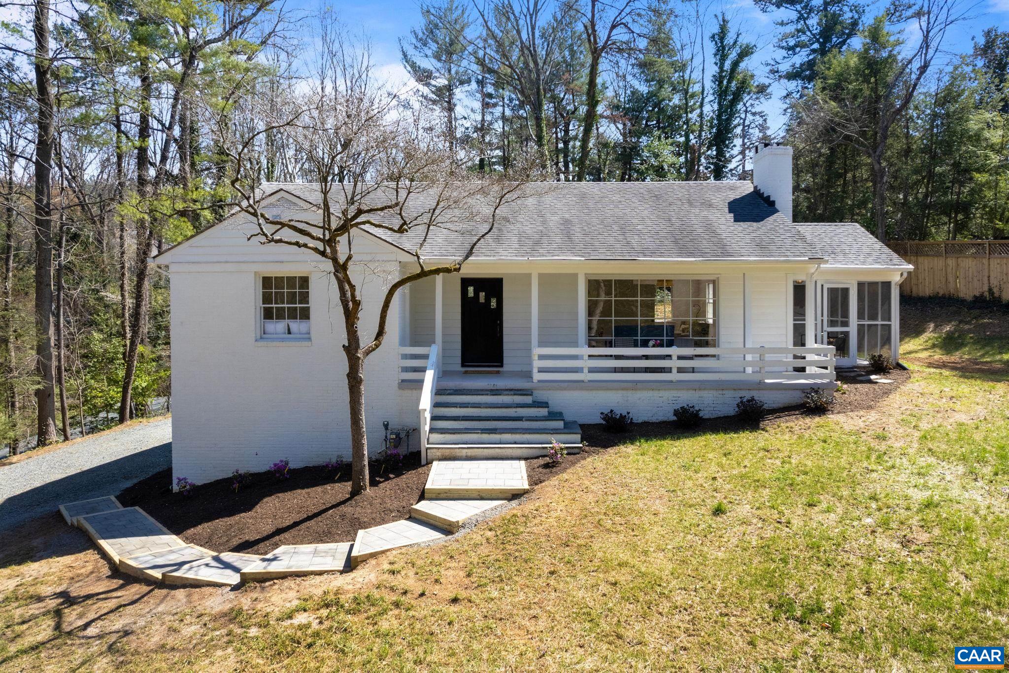 1404 Meadowbrook Road Charlottesville, VA 22903 - Photo 1 of 74 a front view of a house with yard and glass windows