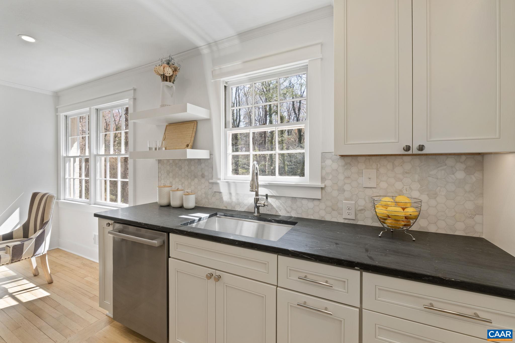 1404 Meadowbrook Road Charlottesville, VA 22903 - Photo 13 of 74 a kitchen with stainless steel appliances granite countertop a sink a stove and a granite counter tops with white cabinets