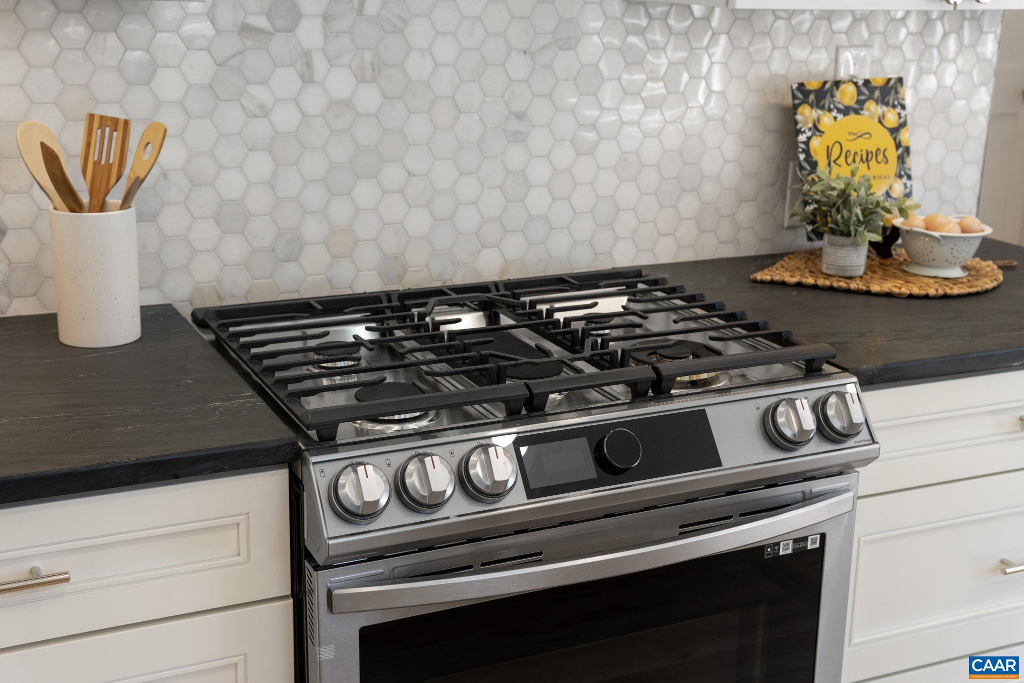 1404 Meadowbrook Road Charlottesville, VA 22903 - Photo 17 of 74 a stove top oven sitting inside of a kitchen