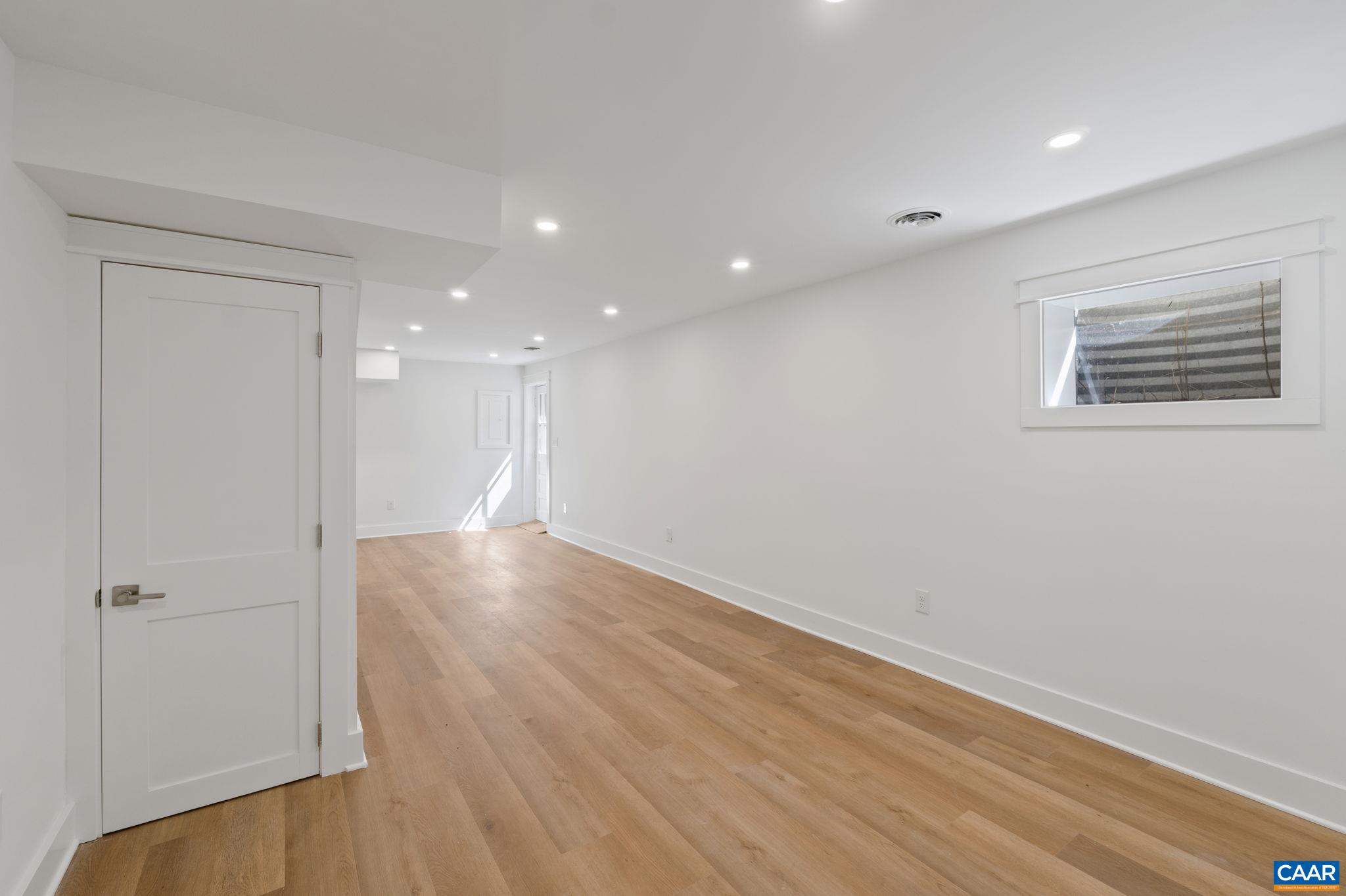 1404 Meadowbrook Road Charlottesville, VA 22903 - Photo 37 of 74 wooden floor in an empty room with a window