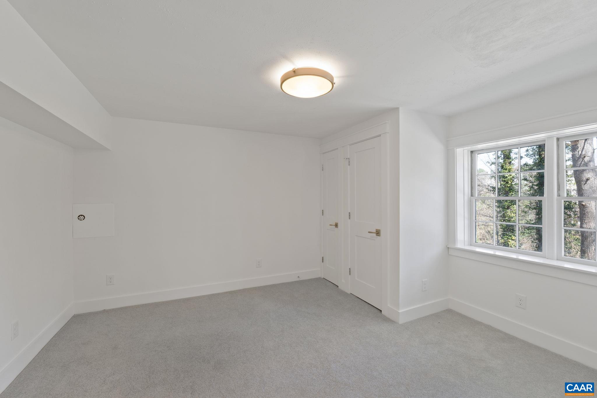 1404 Meadowbrook Road Charlottesville, VA 22903 - Photo 39 of 74 an empty room with a window