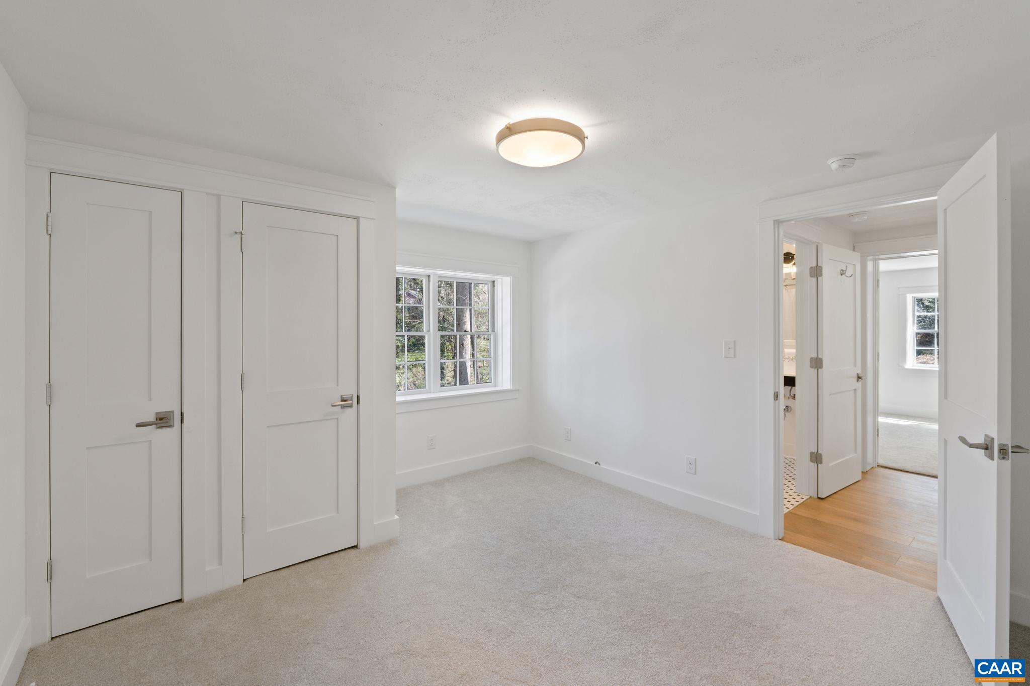 1404 Meadowbrook Road Charlottesville, VA 22903 - Photo 40 of 74 an empty room with windows and closet