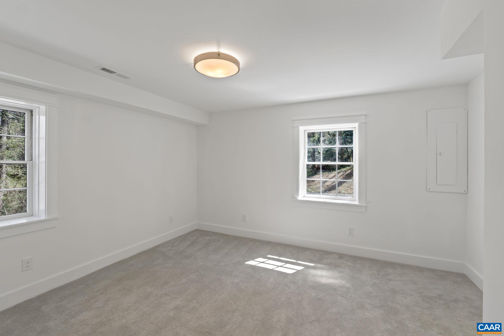1404 Meadowbrook Road Charlottesville, VA 22903 - Photo 41 of 74 an empty room with a window