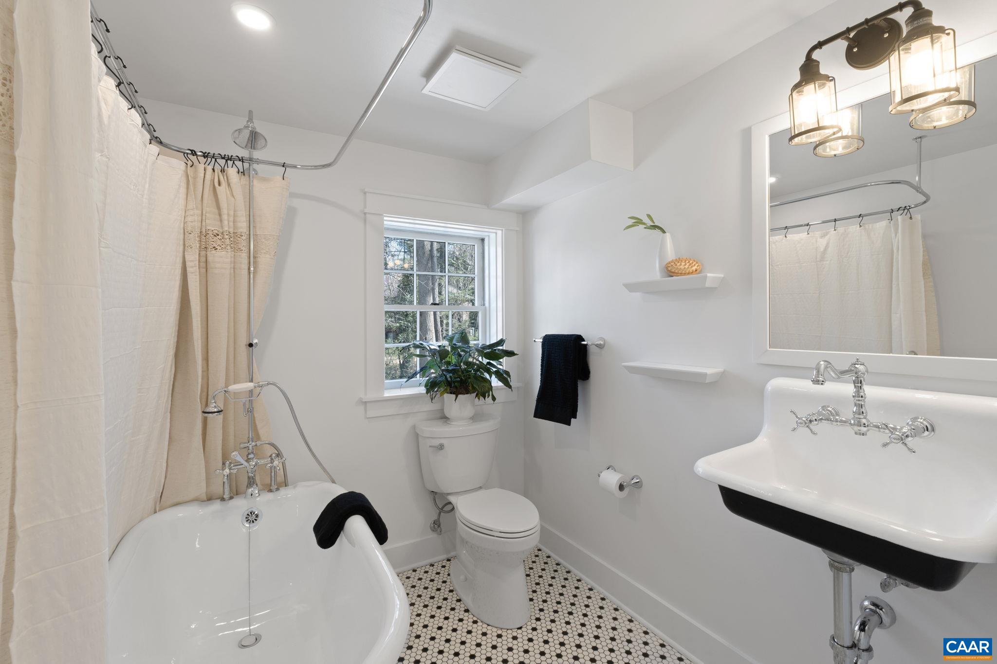 1404 Meadowbrook Road Charlottesville, VA 22903 - Photo 42 of 74 a bathroom with a sink toilet a mirror and shower