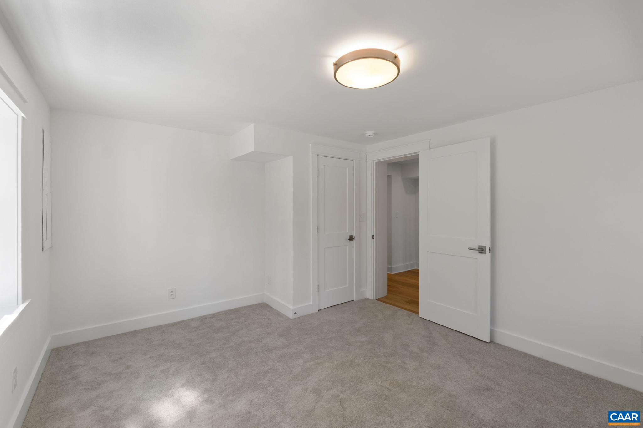 1404 Meadowbrook Road Charlottesville, VA 22903 - Photo 46 of 74 a view of an empty room and a window