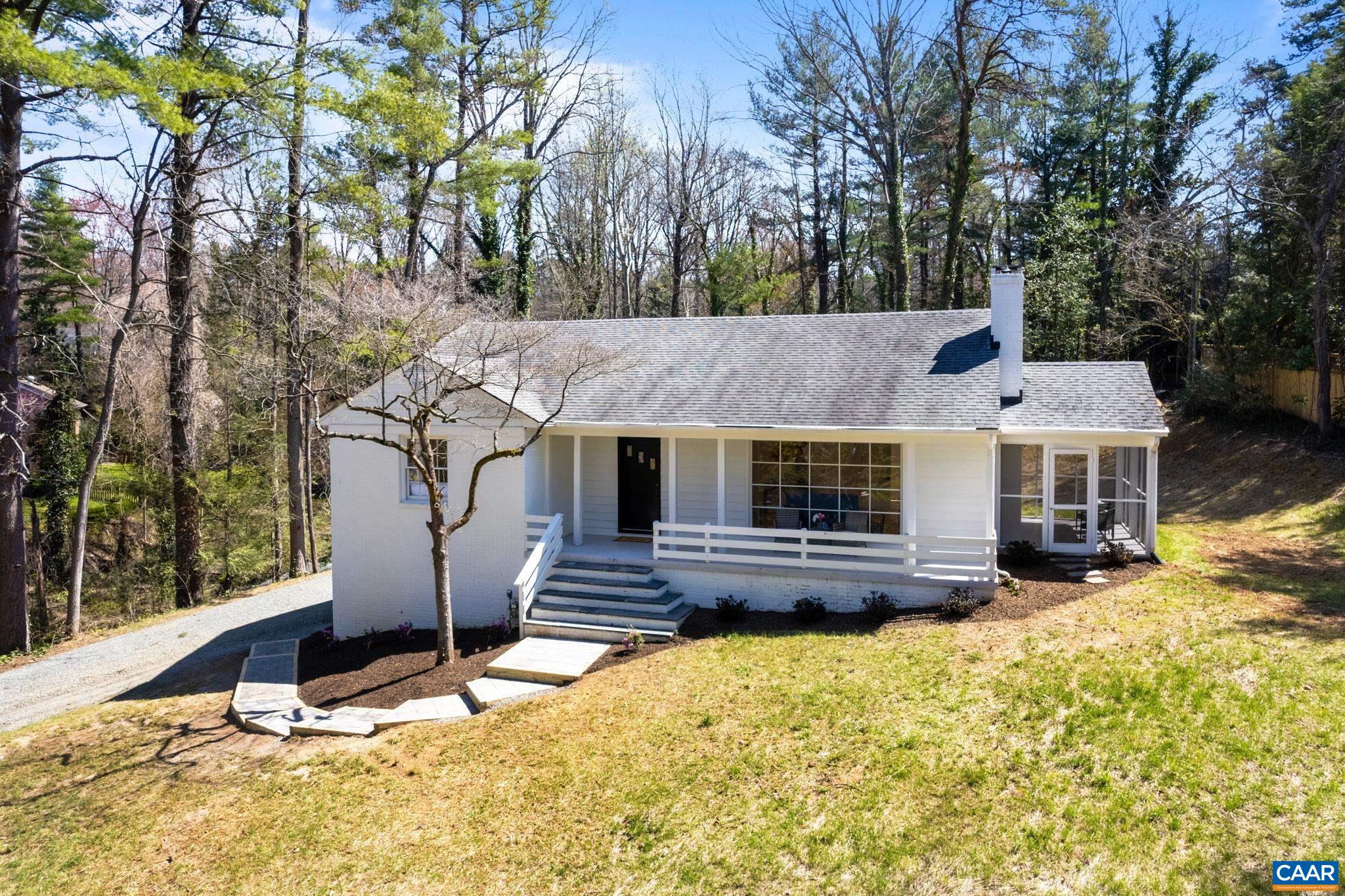1404 Meadowbrook Road Charlottesville, VA 22903 - Photo 67 of 74 a front view of house with yard outdoor seating and covered with trees